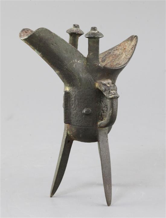 A Chinese archaic bronze wine vessel, Jue, Shang dynasty or later, 19cm high